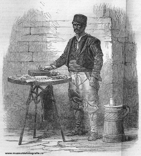Iced Water and Sweetmeat Seller Iced Water and Sweetmeat Seller - gravura realizata de Dr. Mawer dupa o fotografie de Szathmari, publicata la 01 Aprilie 1865 in The Illustrated London News, pag. 300-301